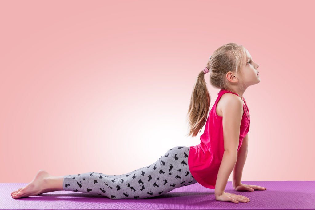 Little girl sitting in yoga pose - Mama OT